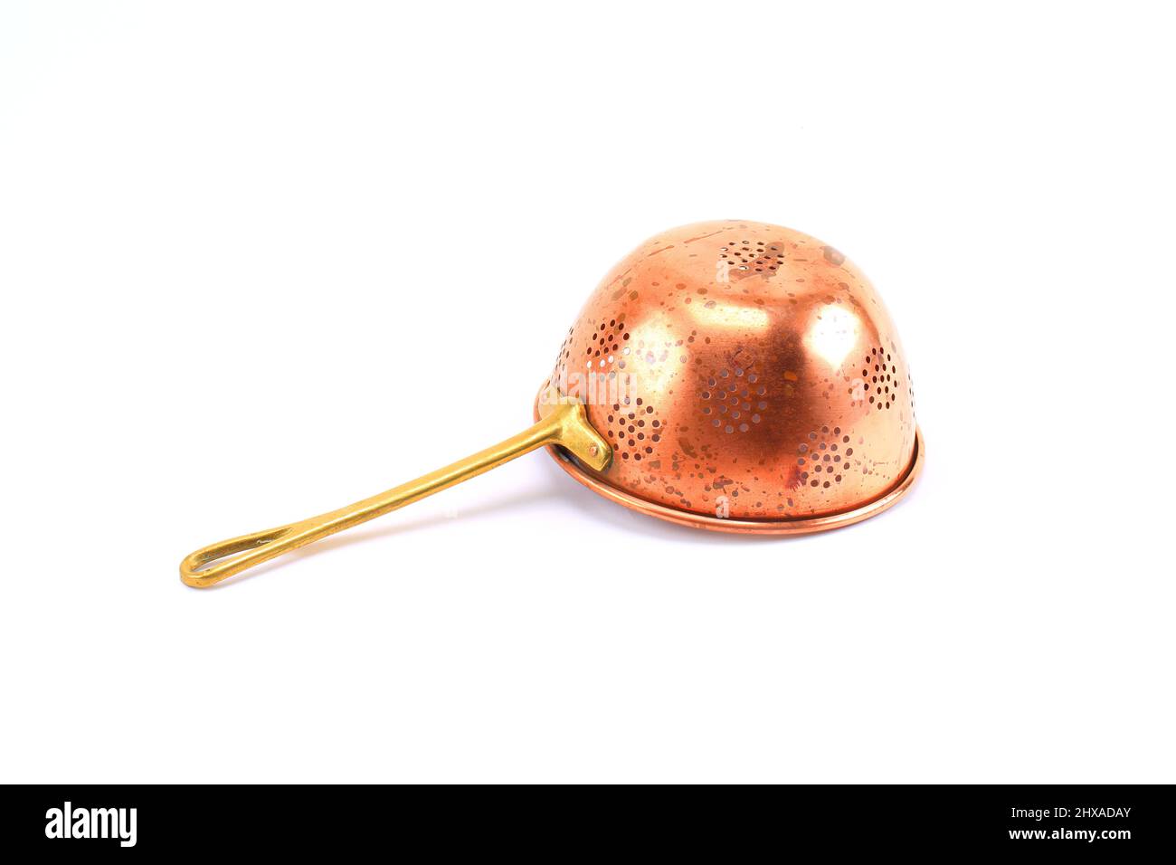 Vintage copper colander white Background Stock Photo - Alamy