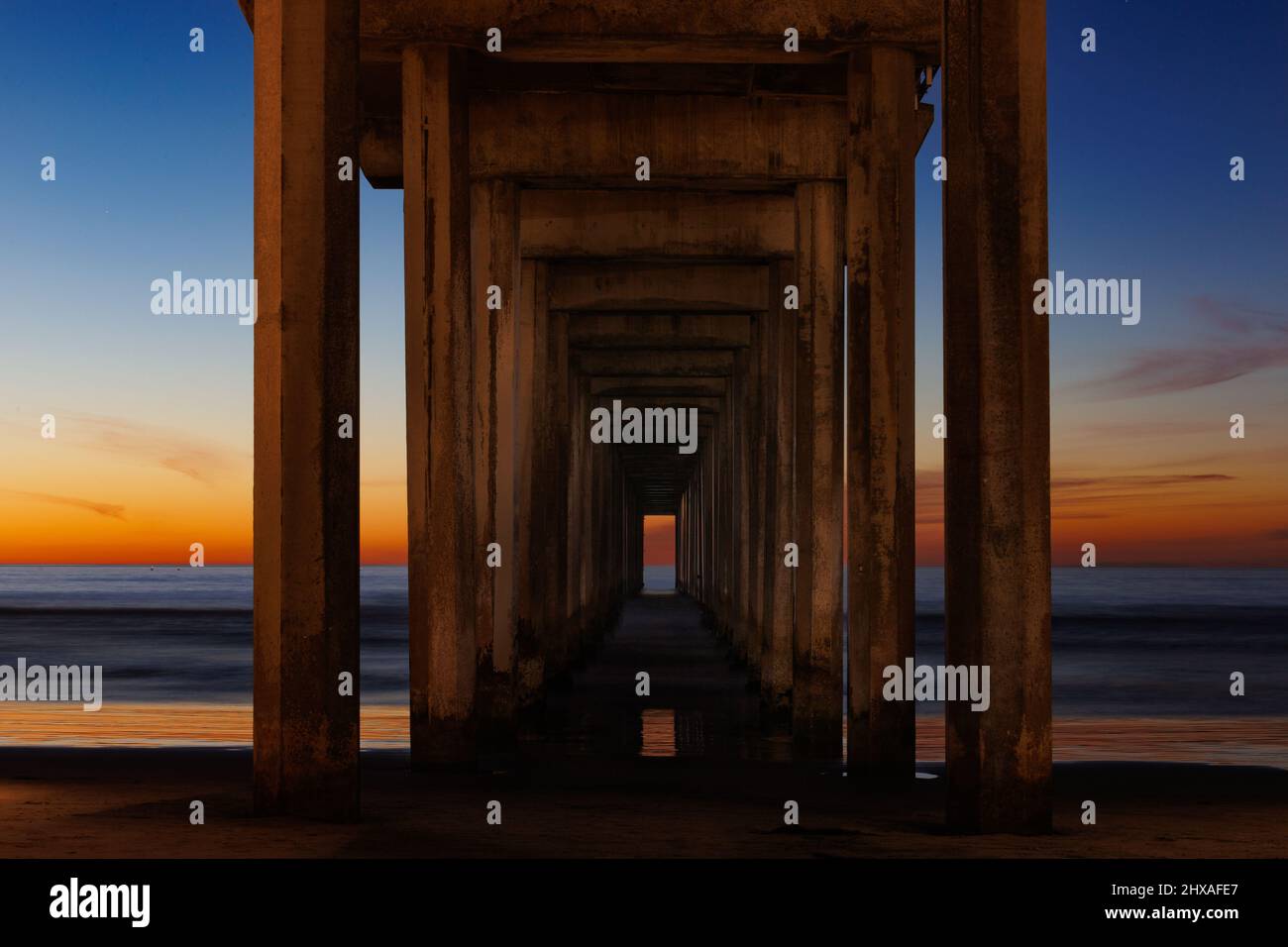 La JOLLA, CALIFORNIA. February 9, 2021. A view of pilings beneath Scripps Pier at sunset. Photo: Mark Johnson/Ironstring Stock Photo