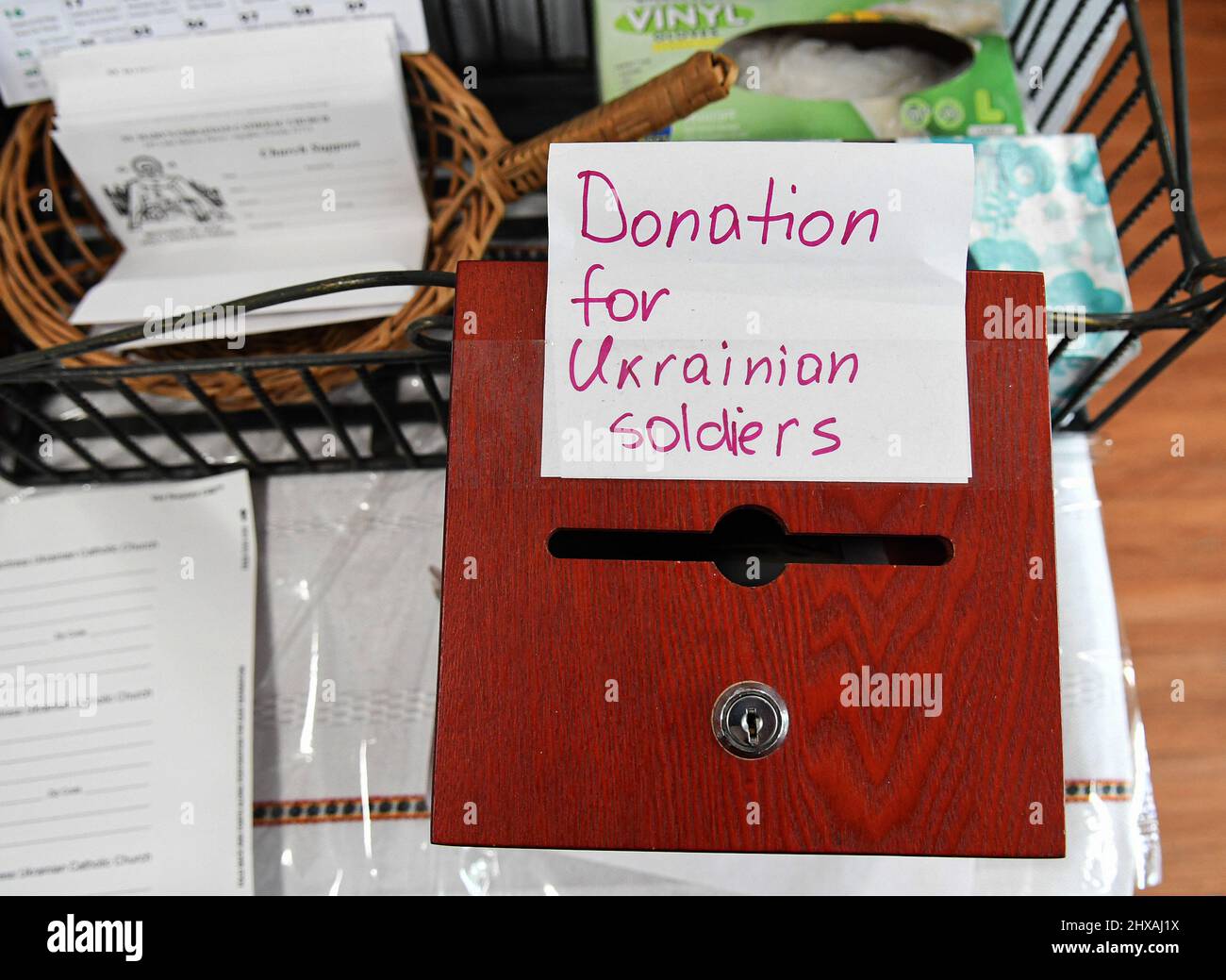 Apopka, United States. 10th Mar, 2022. A collection box for donations for Ukrainian soldiers is seen at St. Mary Protectress Ukrainian Catholic Church in Apopka, Florida near Orlando. The church is collecting donations of clothing, blankets, food, and medical supplies for displaced Ukrainians as the war enters its third week. Credit: SOPA Images Limited/Alamy Live News Stock Photo