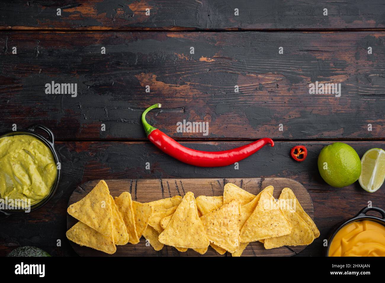 Different dips and sauces for nacho, on old wooden table, top view or ...