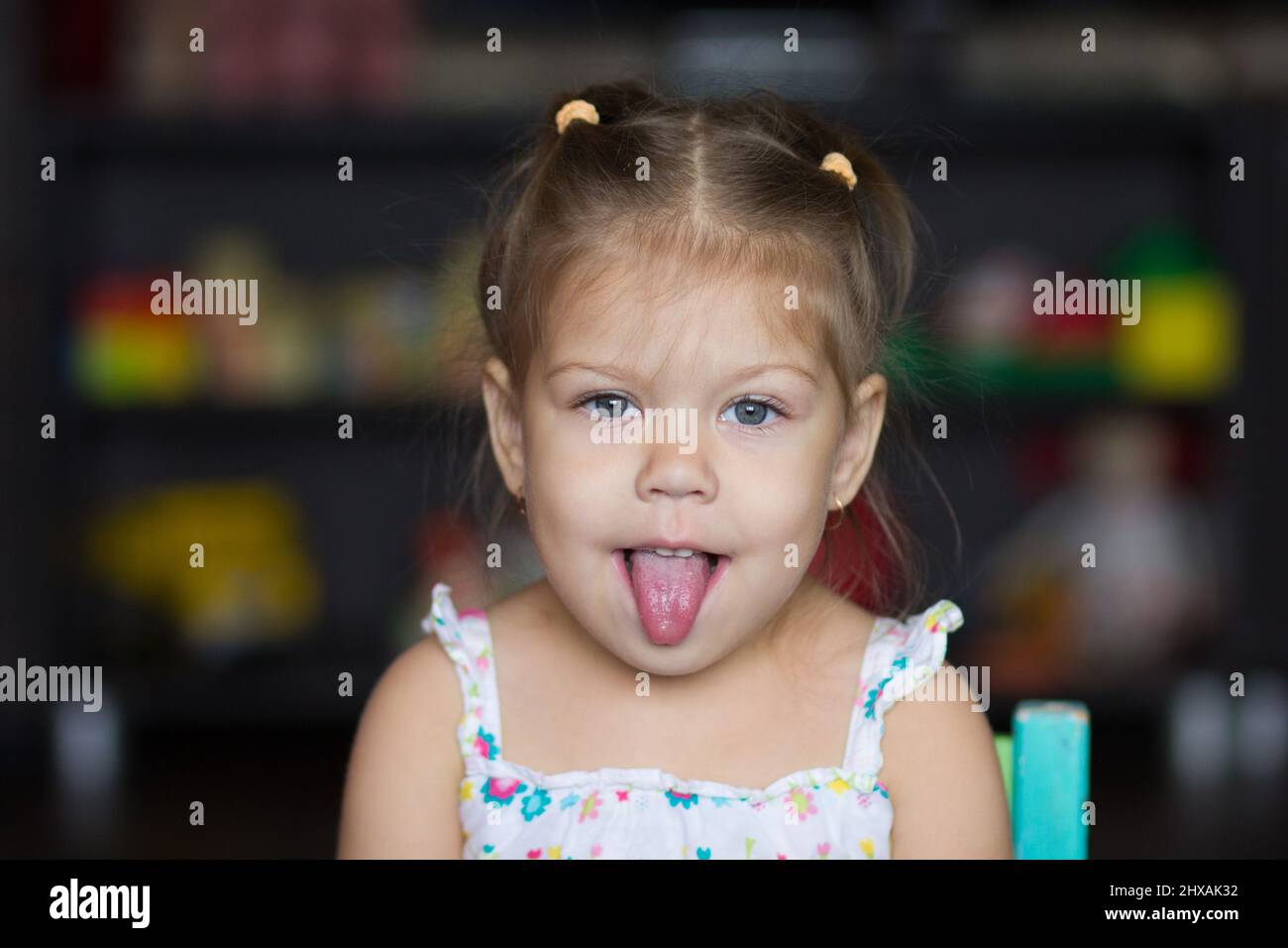 Portrait of the cute little girl looking at camera Stock Photo - Alamy
