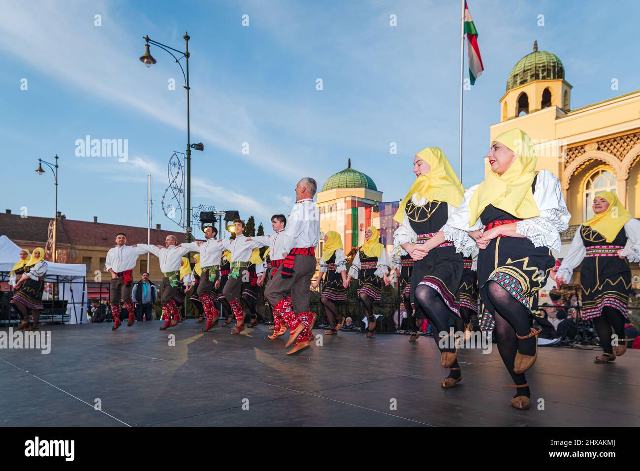 02.28.2022. Mohacs hungary. carnival festival when the winter is ending. Preformers wearing Traditional clotes and masks. They are dancing, walking, Stock Photo