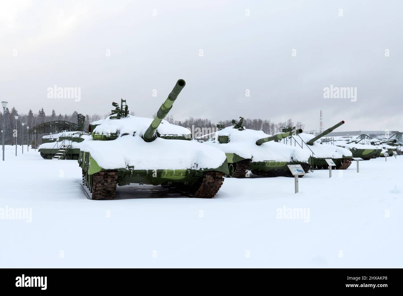 tanks on tracks and other various military equipment in the snow in winter Stock Photo