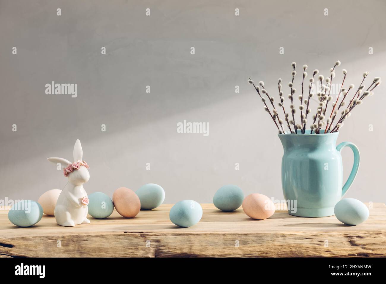 Easter eggs and spring flowers on a wooden table Stock Photo