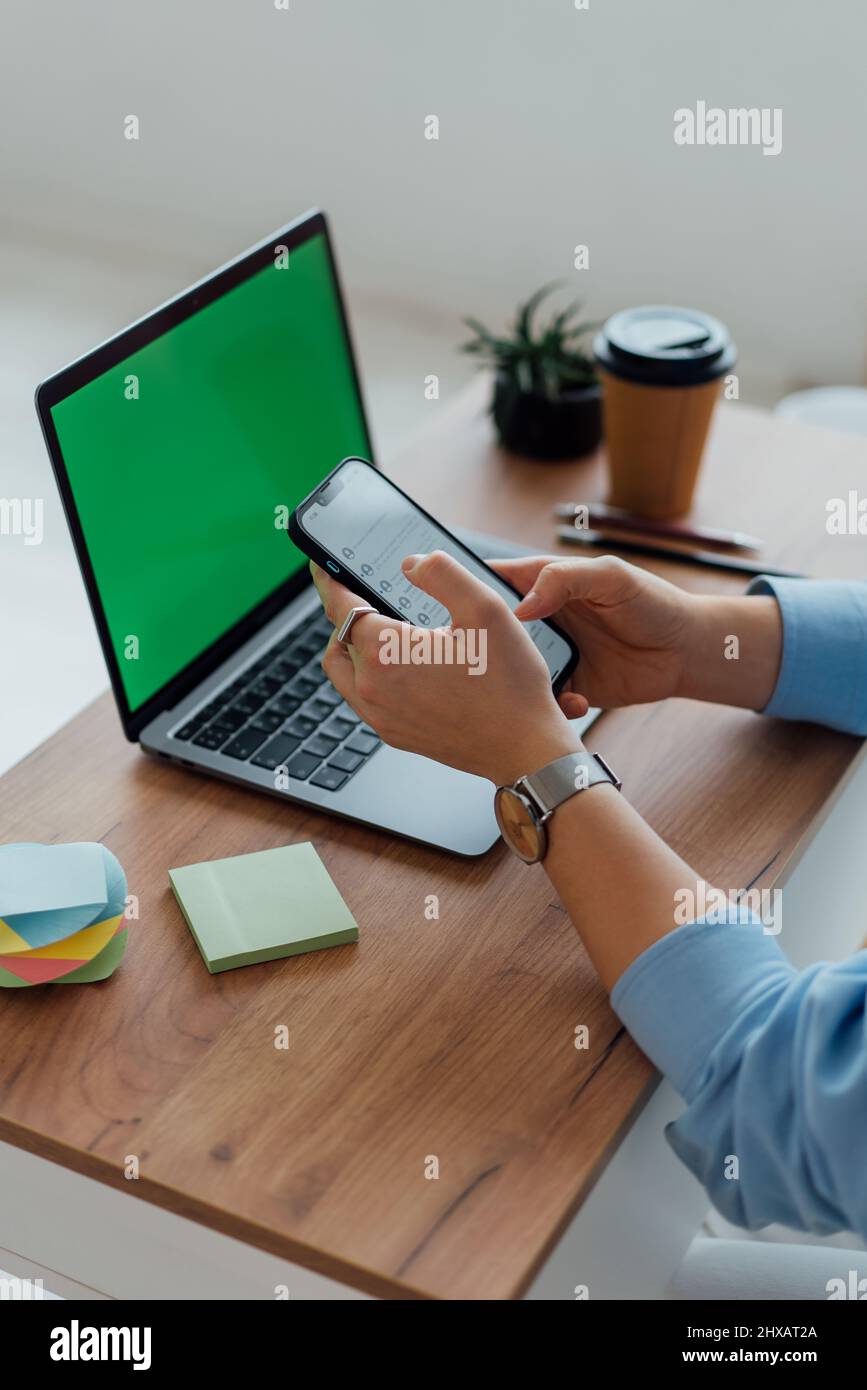 close-up workspace with laptop, telephone and coffee. Office Stock Photo