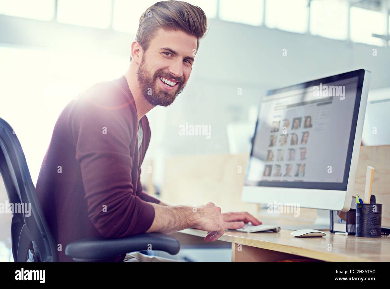 His designs are exemplary. Shot of a designer at work in an office. Stock Photo