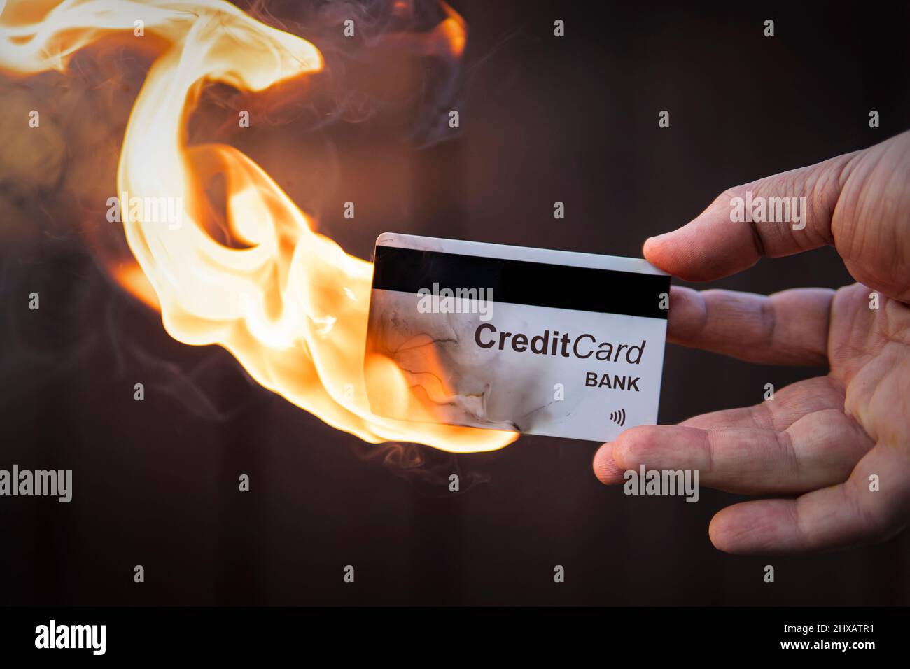 Destruction of card payment. Termination of the validity of the electronic payment system. The absolute demolition of credit cards. credit card in han Stock Photo