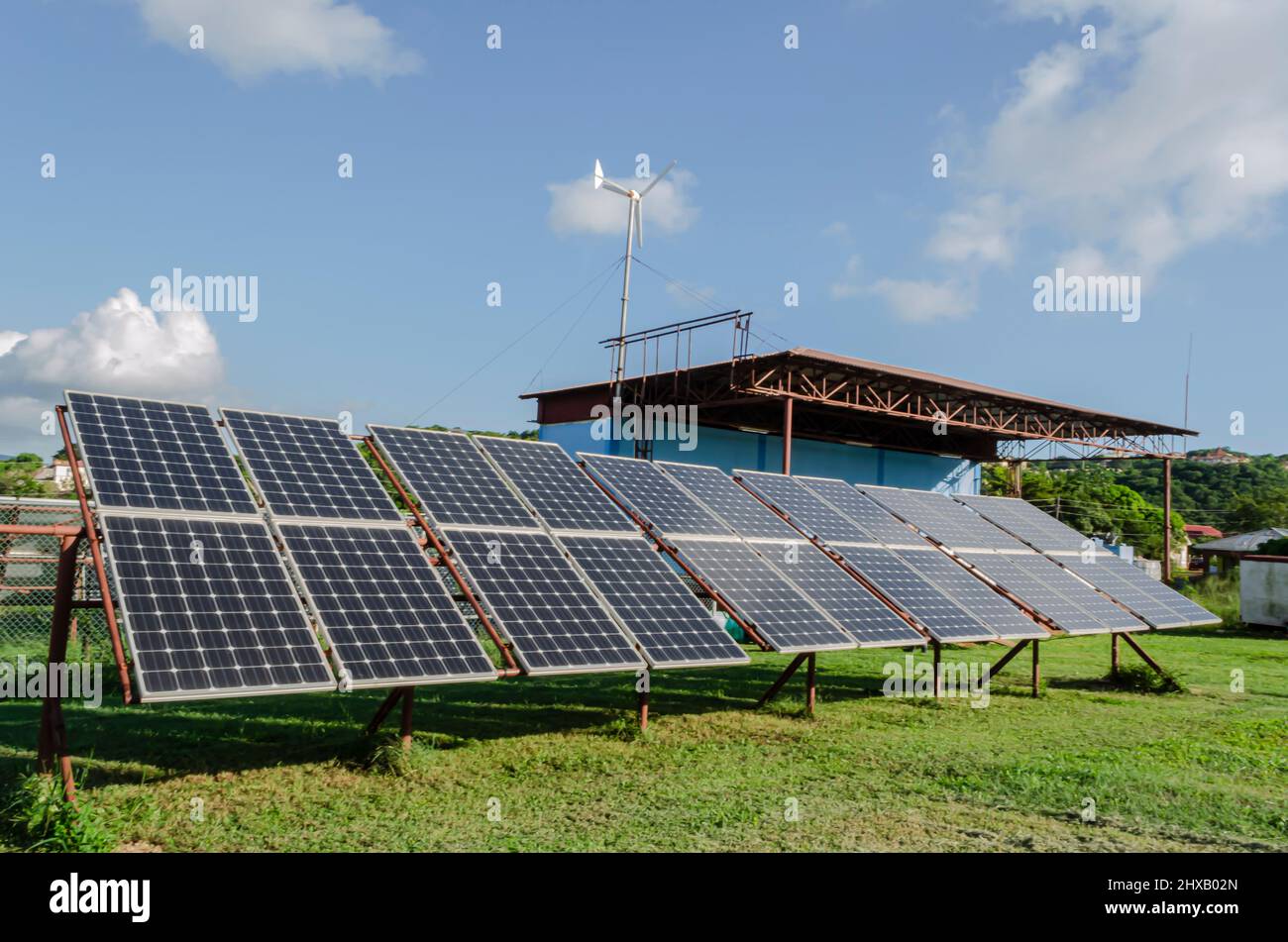 Solar Panels And Wind Mill Stock Photo - Alamy