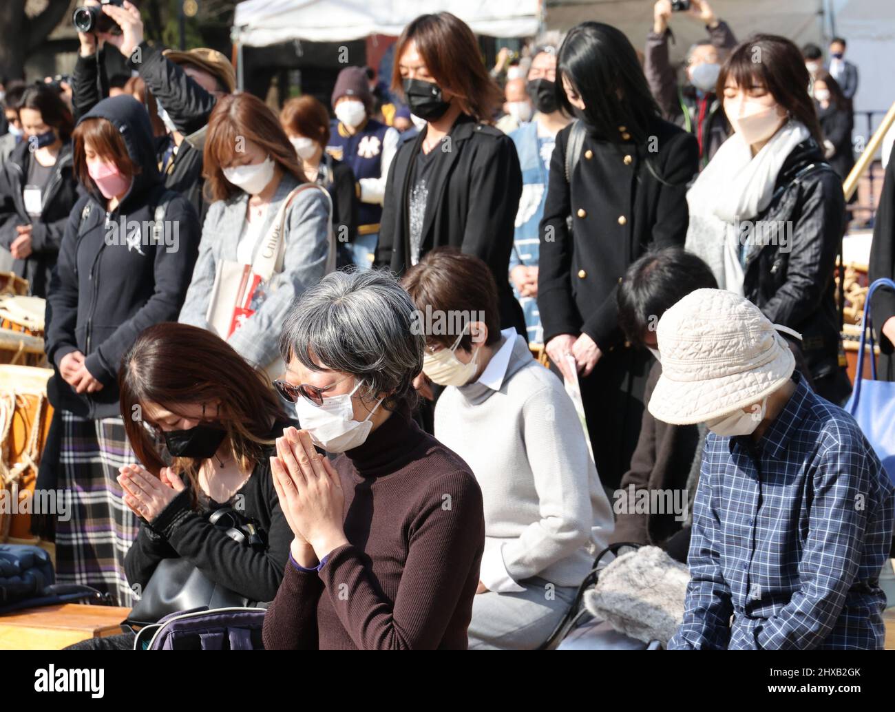 Tokyo, Japan. 11th Mar, 2022. People pray in silence for the victims of 3.11 massive earthquake and tsunami in Tokyo on Friday, March 11, 2022. Japan marked the 11th anniversary day of the East Japan Great Earthquake which killed some 20,000 in 2011. Credit: Yoshio Tsunoda/AFLO/Alamy Live News Stock Photo