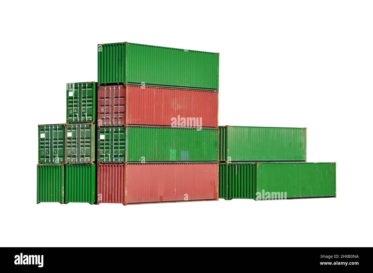 Green and red containers unloaded from or to be loaded on the cargo ship, isolated on white background Stock Photo