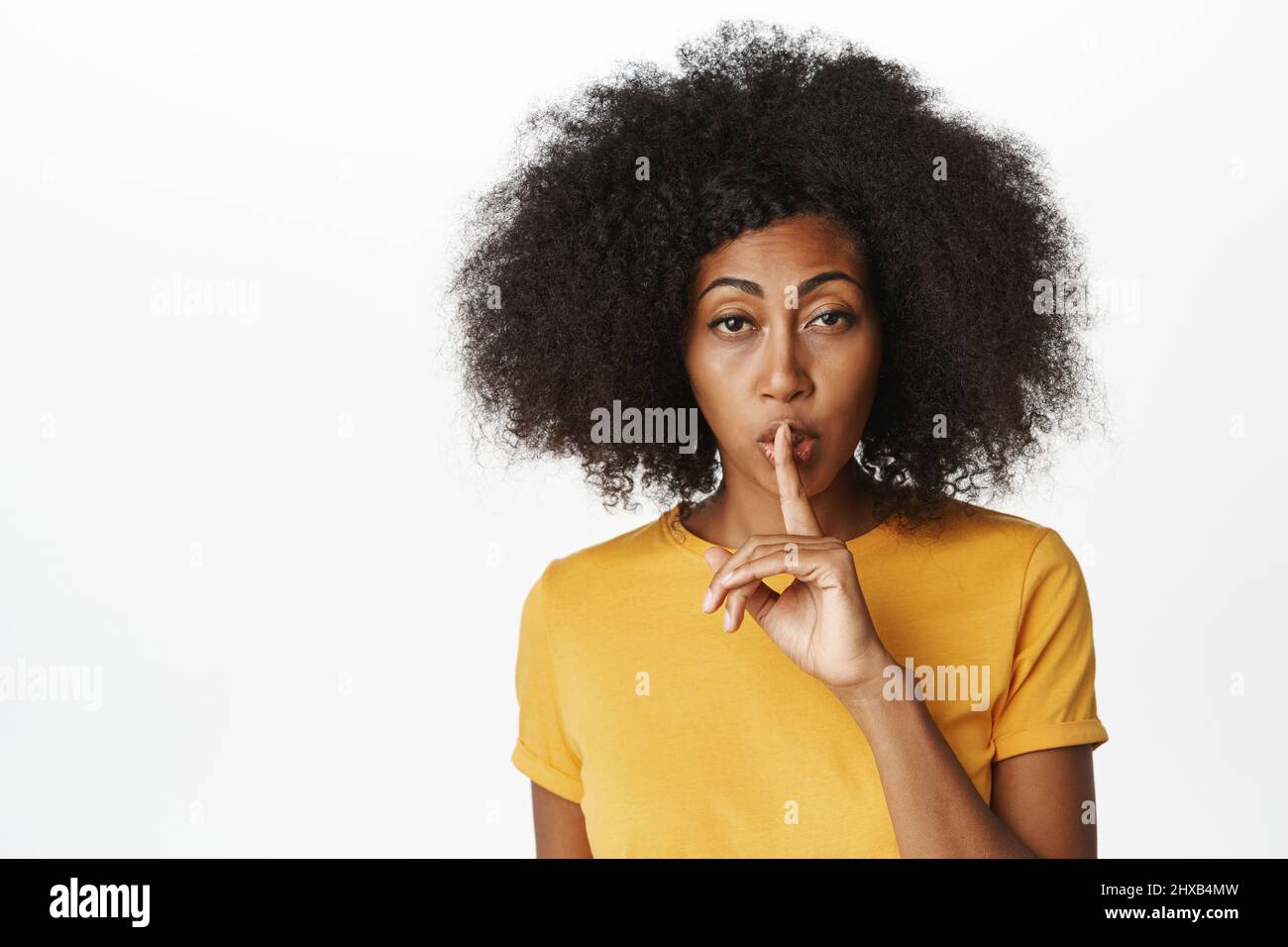 Close Up Of African American Woman Shushing Making Hush Taboo Silence