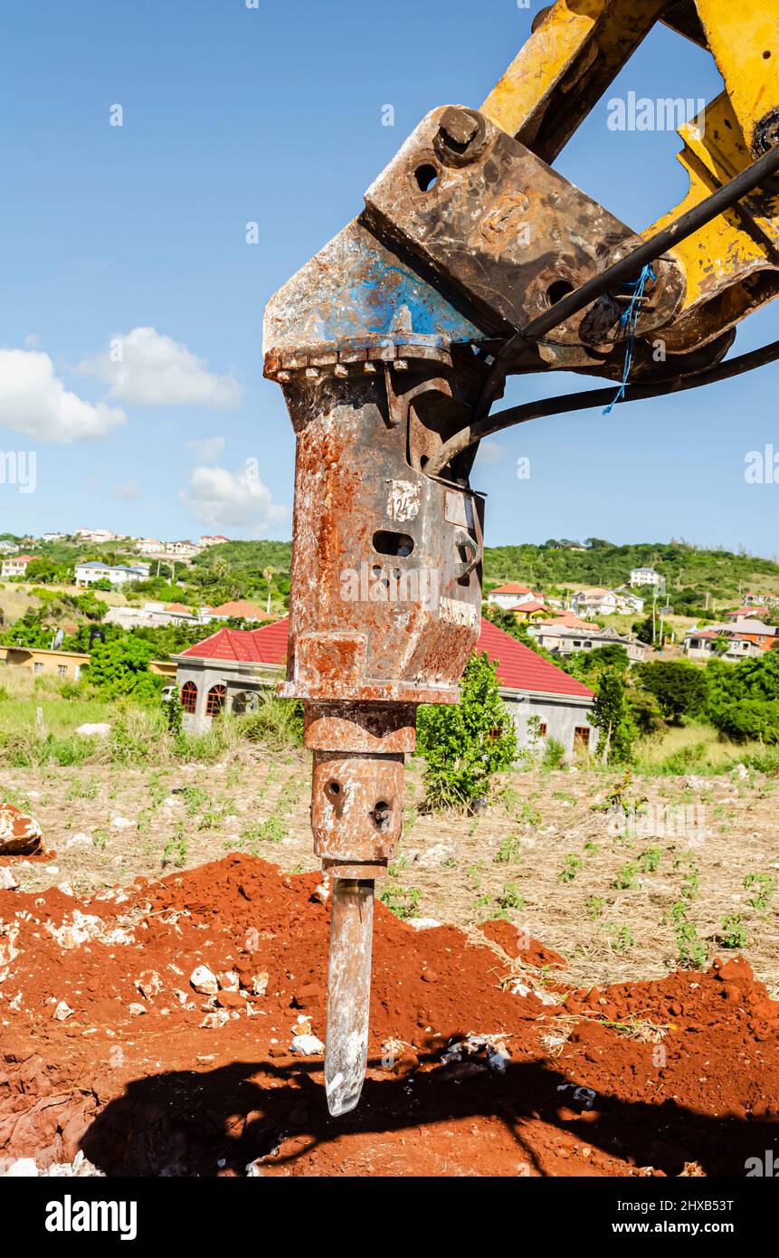 This is the closeup of a heavy duty jackhammer is attached to the