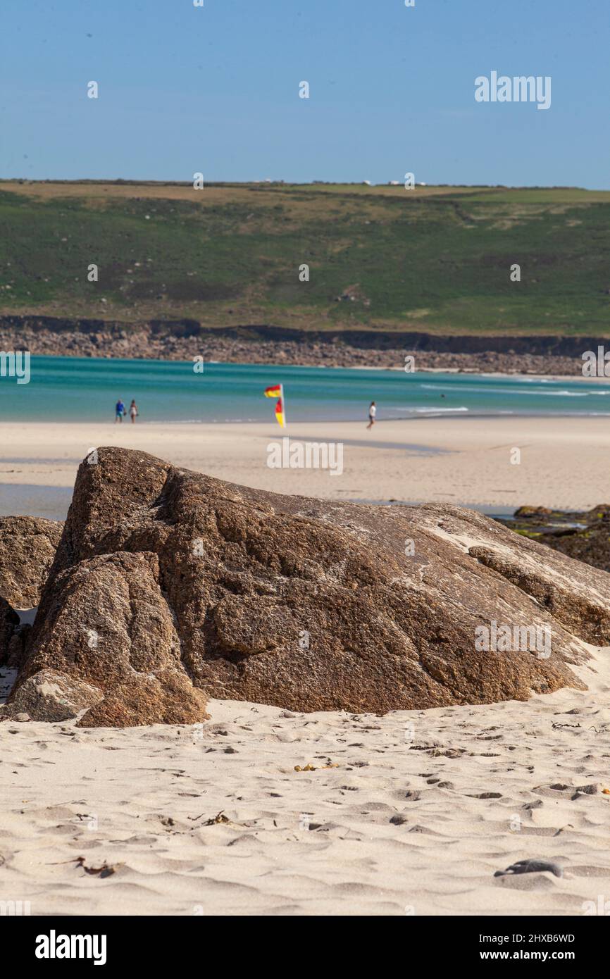 The suns shines over an empty beach in Cornwall Stock Photo