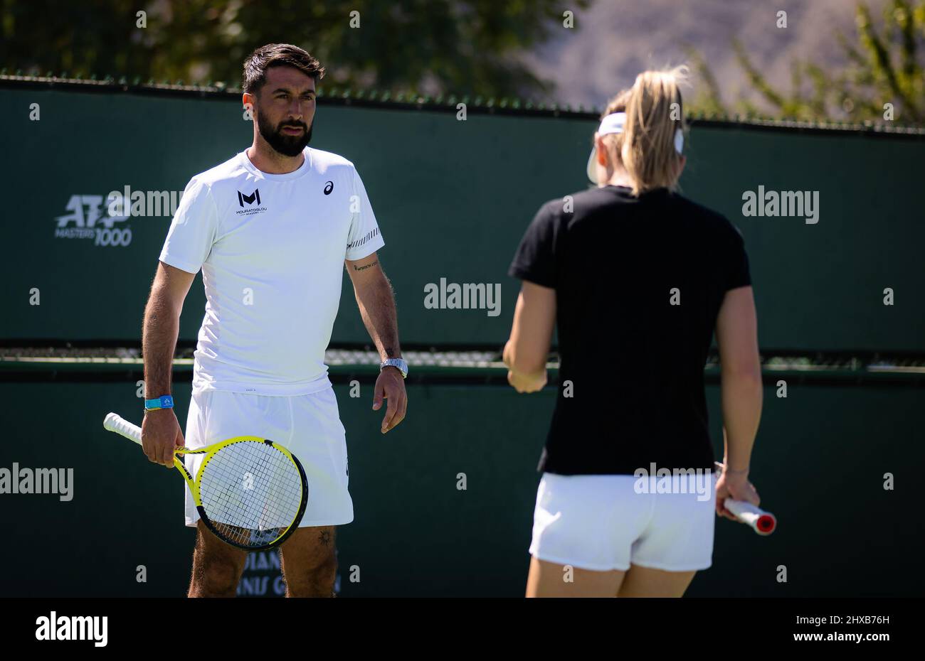 Morgan Bourbon during practice with Simona Halep at the 2022 BNP