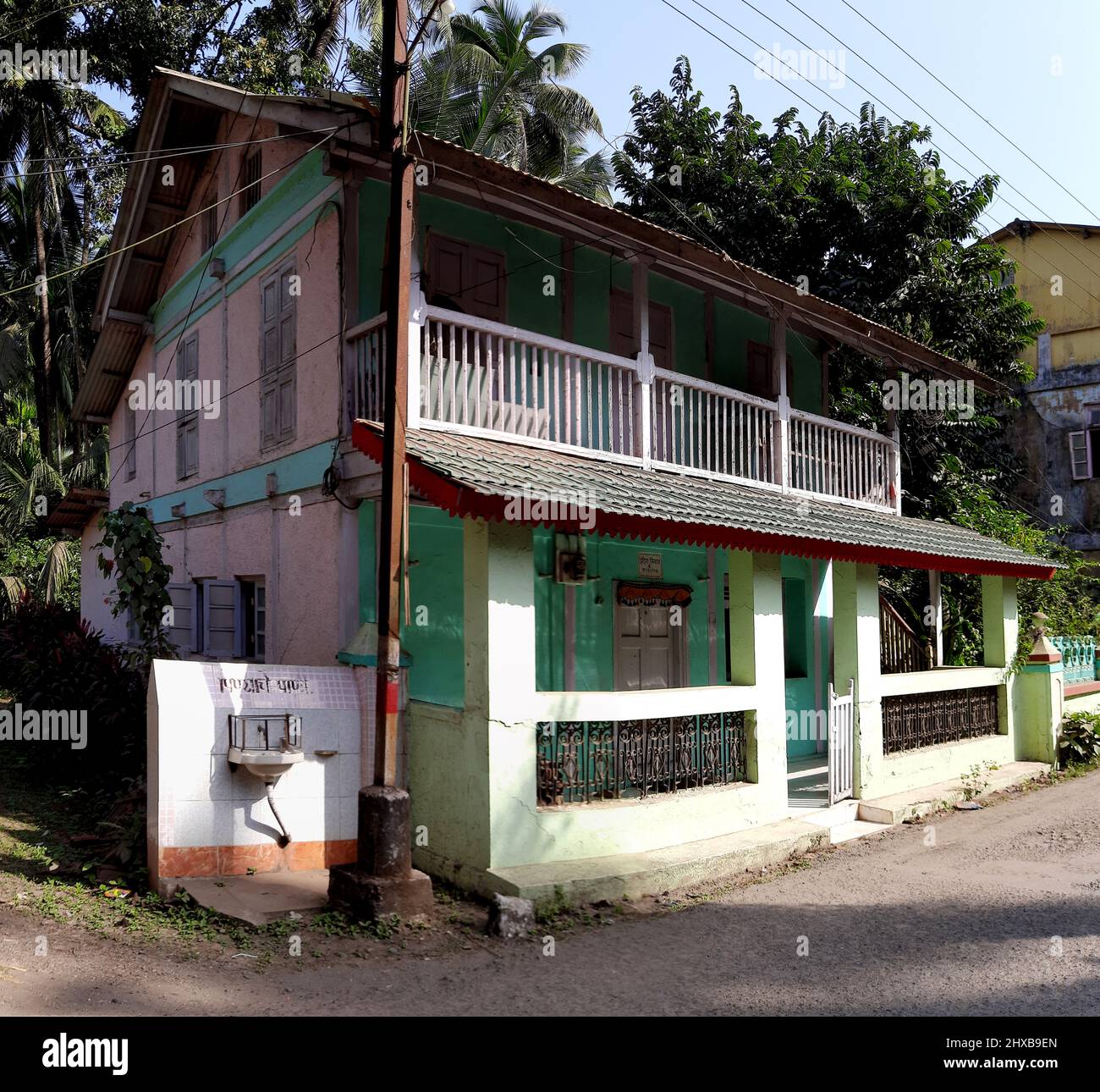 tiled-roof-house-of-konkan-area-near-road-at-revdanda-near-alibag-state-maharashtra-india-stock