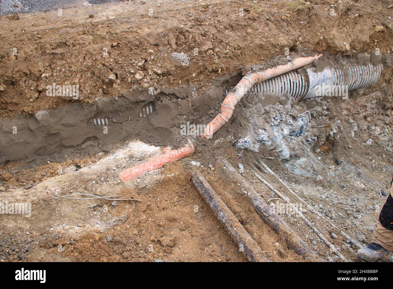 Supply line in an excavation pit Stock Photo