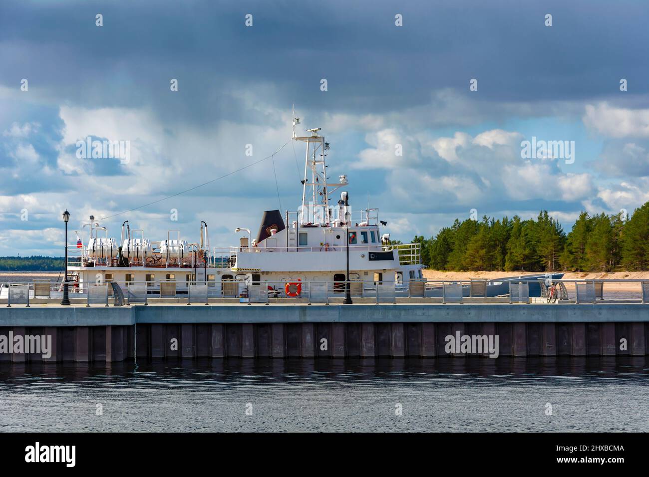 Boat at the pier of the Konevsky Monastery on the island of Konevets in Lake Ladoga Stock Photo