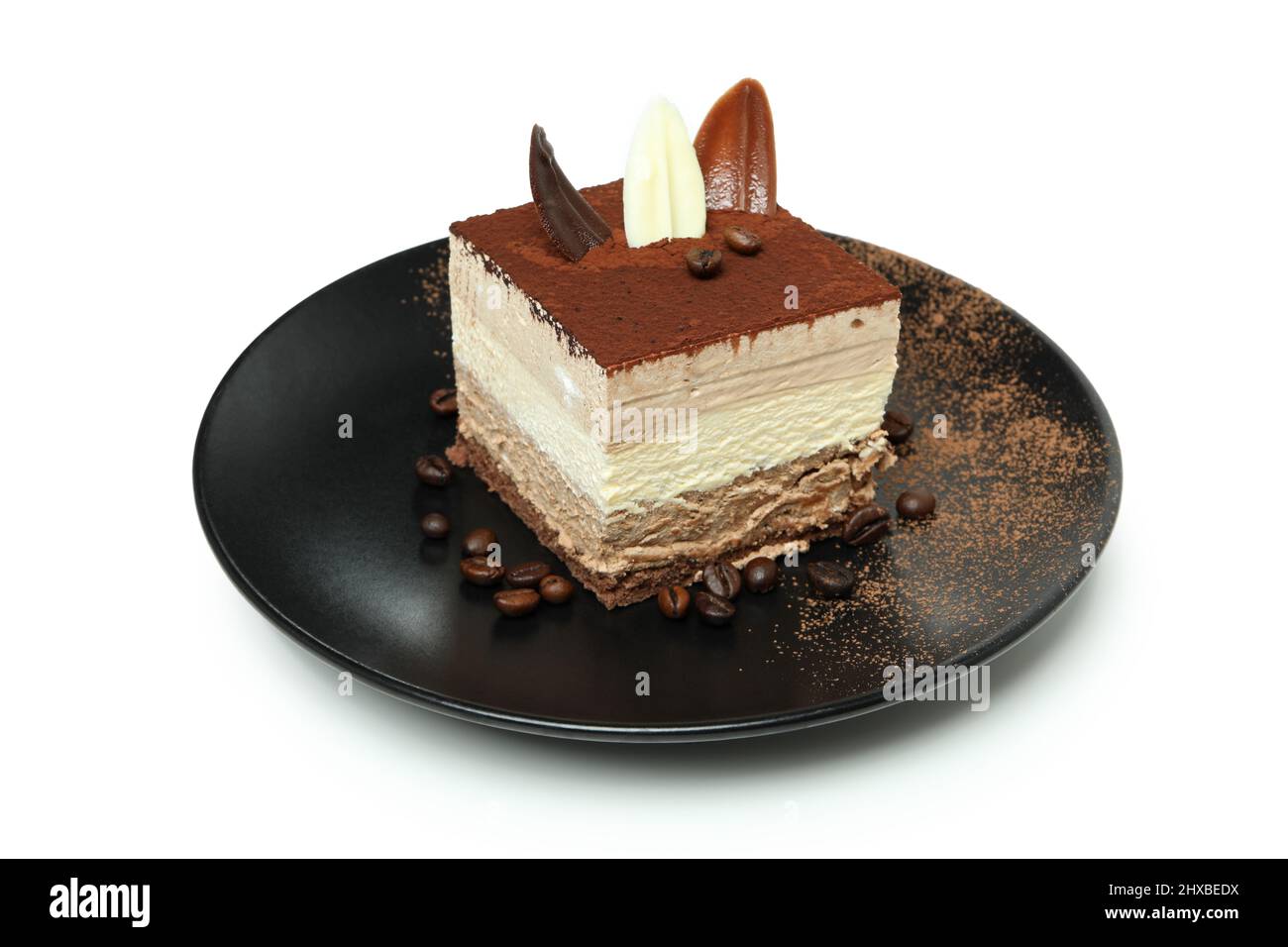 Plate with Tiramisu cake isolated on white background Stock Photo