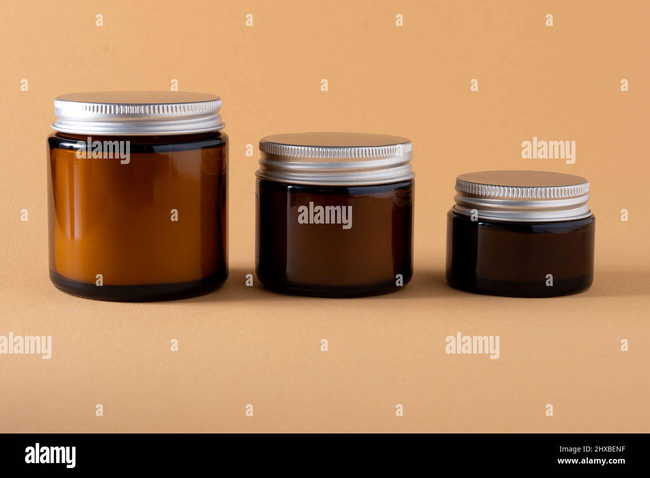 Candle in a jar with a lid mockup of different sizes. A set of