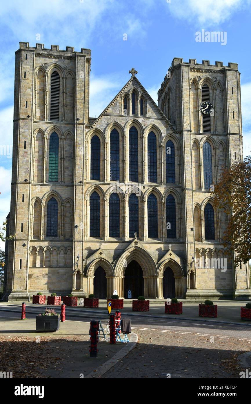 close up portrait image of majestic Ripon cathedral, the stone historical structure standing tall  on a beautiful sunny day in Autumn Stock Photo