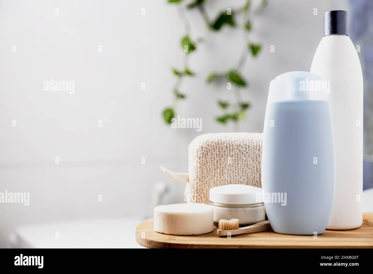 Preparation for hotel spa treatment or home bath procedure. Bathroom with  accessories and cosmetics. Shampoo, shower gel, hair conditioner,  washcloth, soap, tooth brush, cream glass bottle, white soap Stock Photo -  Alamy