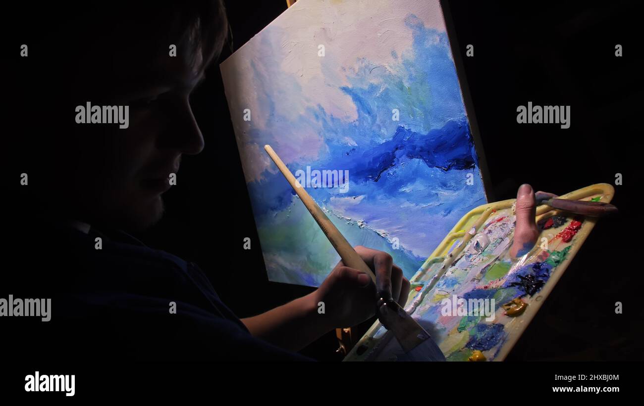 Artist copyist paint seascape with ship in ocean. Craftsman decorator ...