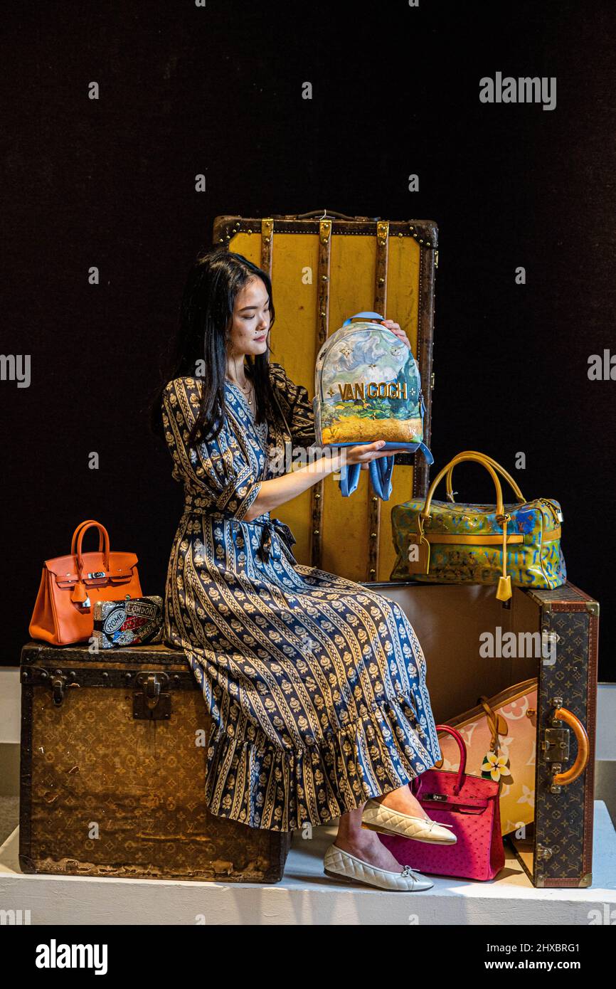 LONDON, UK. 11 March, 2022 . A staff member holds Louis Vuitton x Jeff  Koons: a Van Gogh 'Palm Springs' Backpack, Limited Edition Masters  Collection, 207. Estimate: £1,500 – 2,000 which will