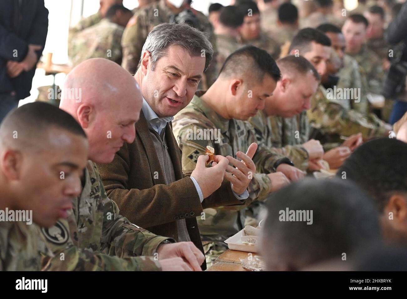 Markus SOEDER (Prime Minister of Bavaria and CSU Chairman) speaks to American soldiers on the occasion of a Weisswurst meal, Bavarian Weisswurst Fruehstueck Prime Minister Dr. Markus Soeder visits the US military training area Grafenwoehr, headquarters of the 7th Army Training Command on March 11th, 2022. Stock Photo