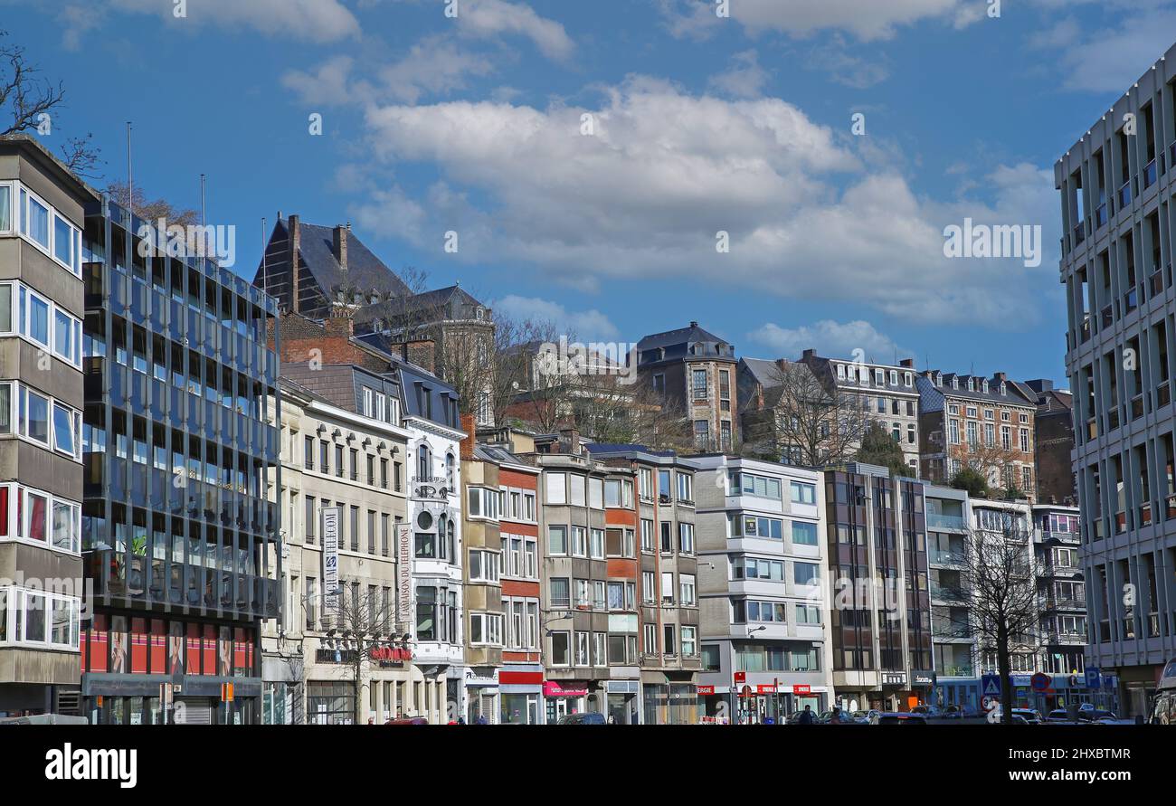 Liege (Bd de la Sauveniere), Belgium - March 5. 2022: View on cityscape in town center with modern and medieval buildings against blue sky Stock Photo