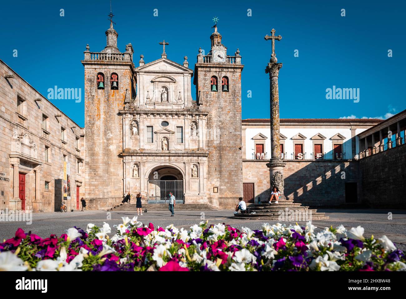 Viseu, Portugal; September 3th, 2021: Historic city centre of Viseu, with the cathedral in the background and a flower bed in the foreground. Stock Photo