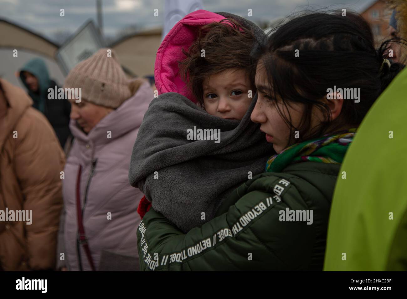 Ukrainian refugees arrive in Poland through the Medyka border.Thousands of Ukrainians arrive in Poland across the Medyka border fleeing the war. Since Russia's invasion of Ukraine began, more than 2 million people have fled for refuge, the vast majority of them women and children. (Photo by Fer Capdepon Arroyo/Pacific Press) Stock Photo