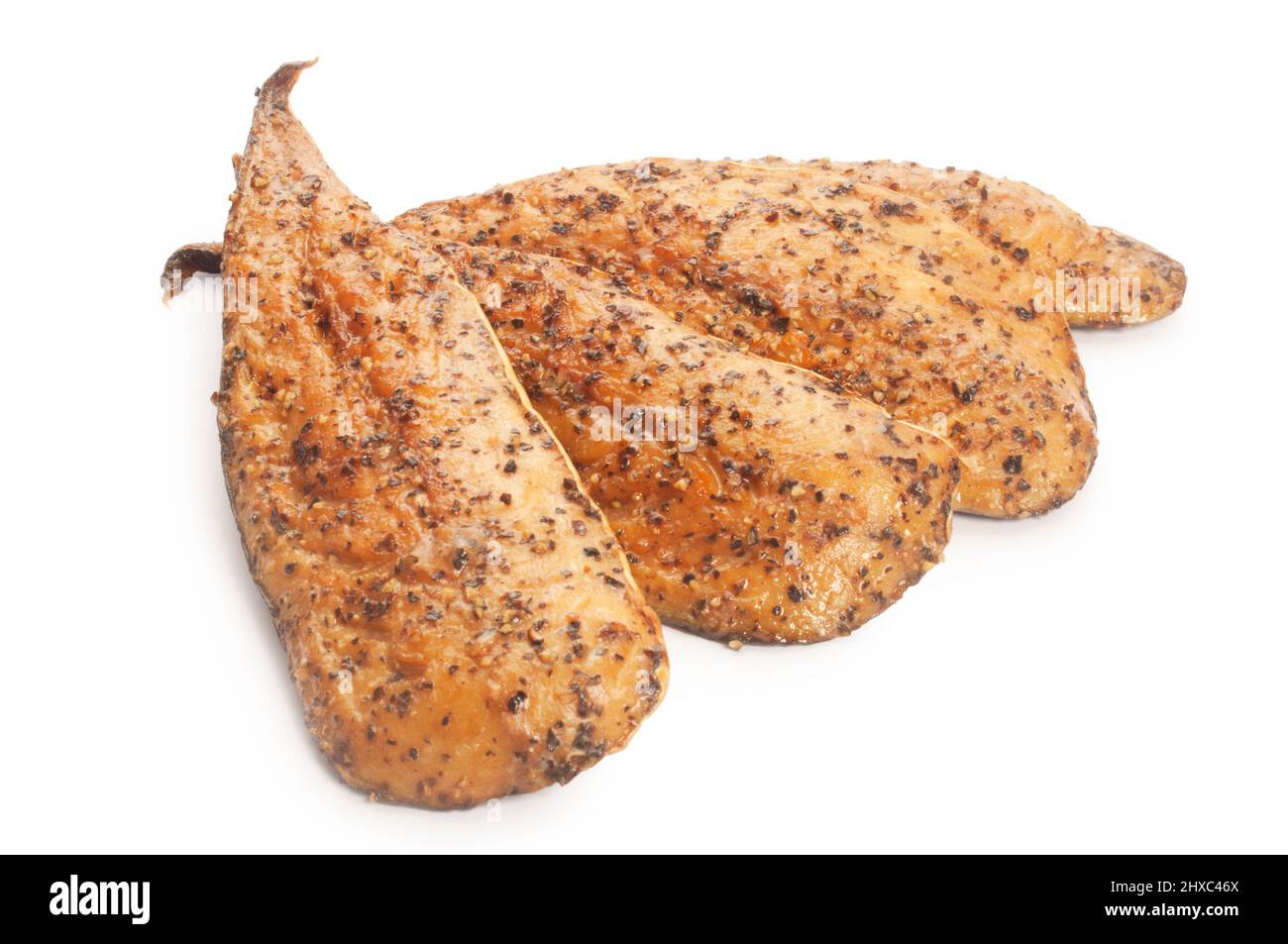 Studio shot of hot smoked, peppered mackerel fillets cut out against a white background - John Gollop Stock Photo