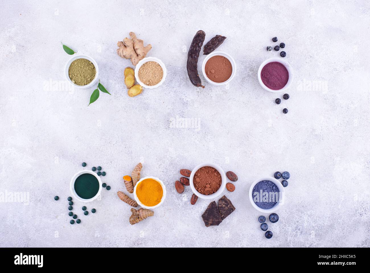 Various healthy superfoods powder Stock Photo - Alamy