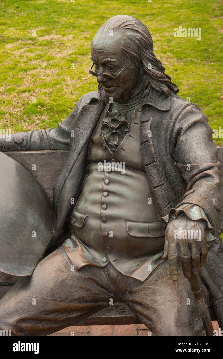 Ben Franklin bronze sculpture sitting on bench in Smithfield Virginia