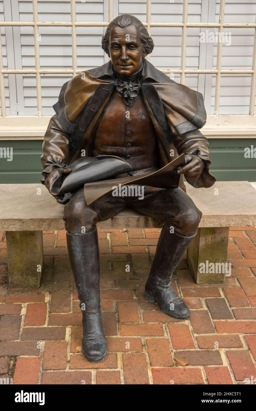Washington bronze sculpture sitting on bench in Smithfield