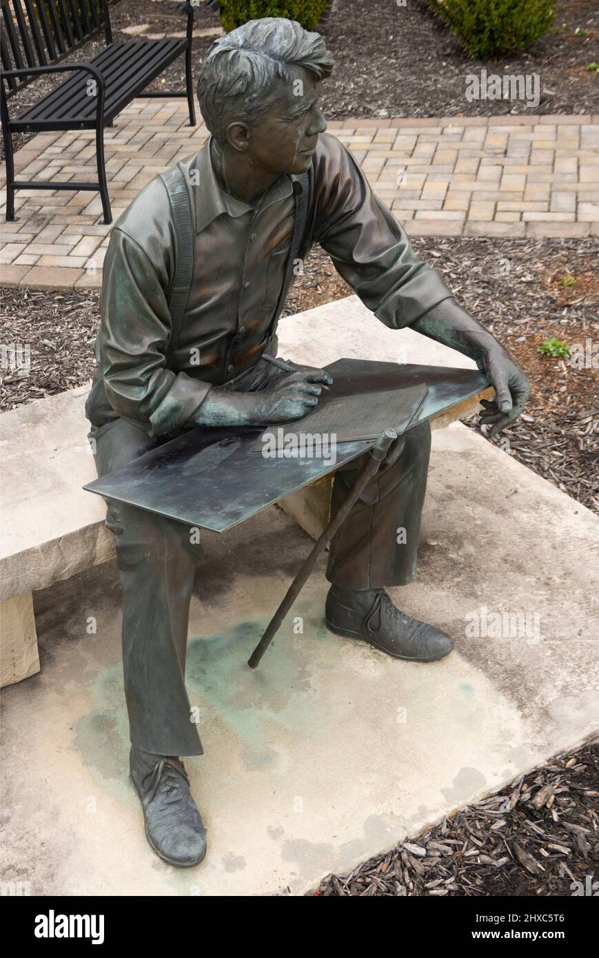 Robert Frost bronze sculpture sitting on bench in Smithfield Virginia