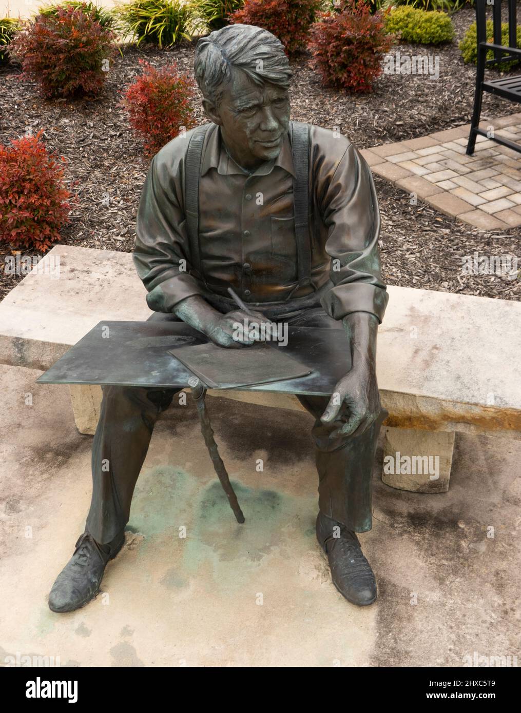Robert Frost bronze sculpture sitting on bench in Smithfield Virginia