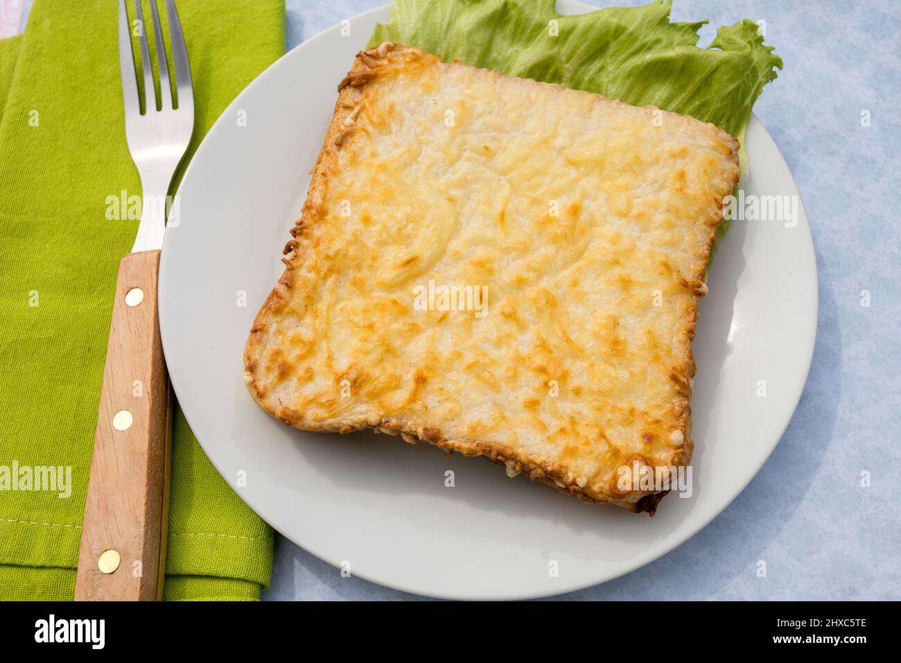 baked croque monsieur in a white plate Stock Photo - Alamy