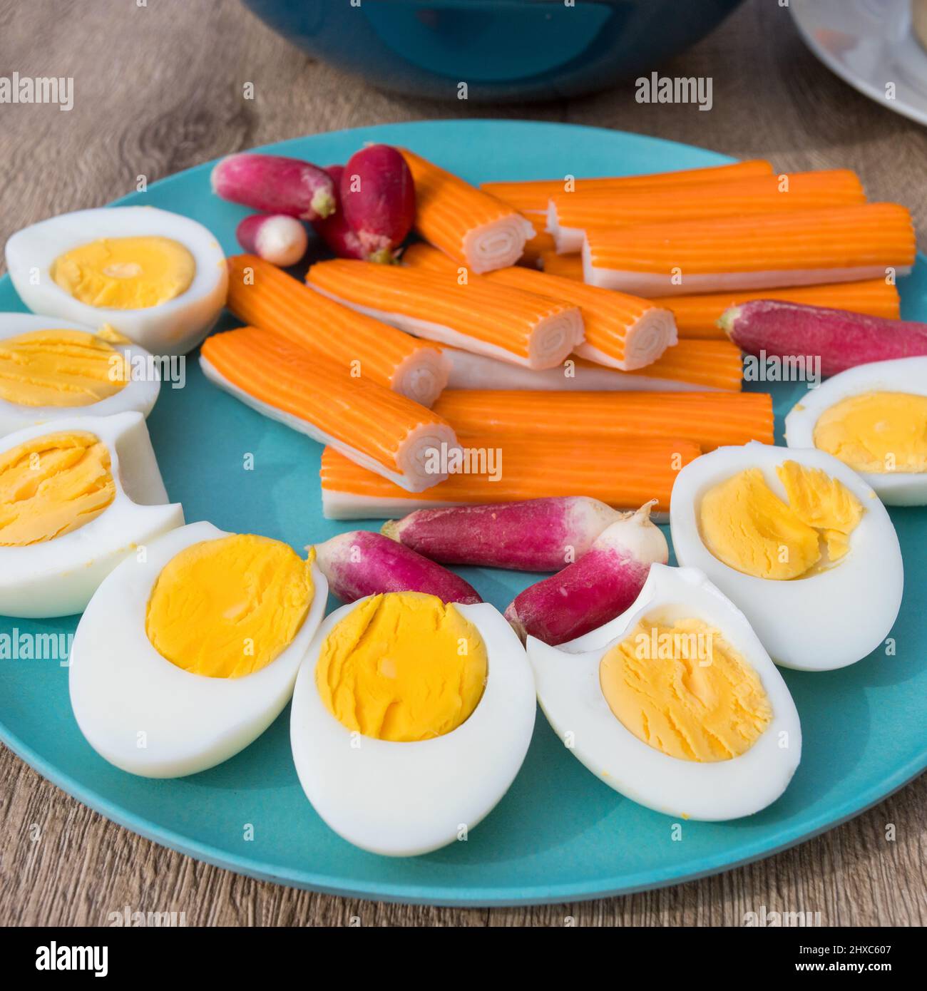 plate of surimi, hardboiled eggs, and radishes Stock Photo Alamy