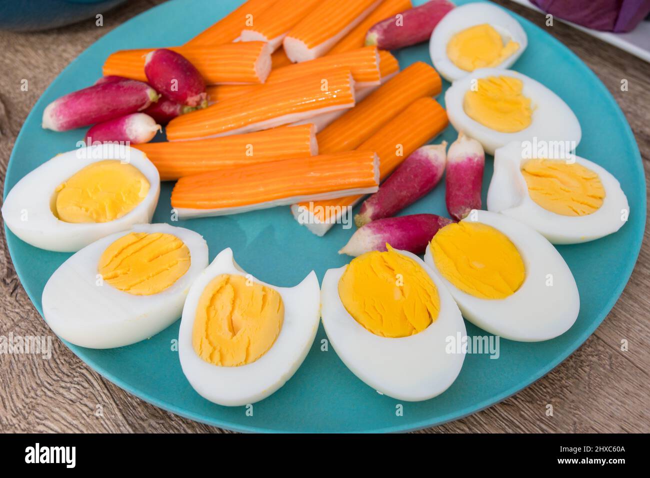 plate of surimi, hardboiled eggs, and radishes Stock Photo Alamy