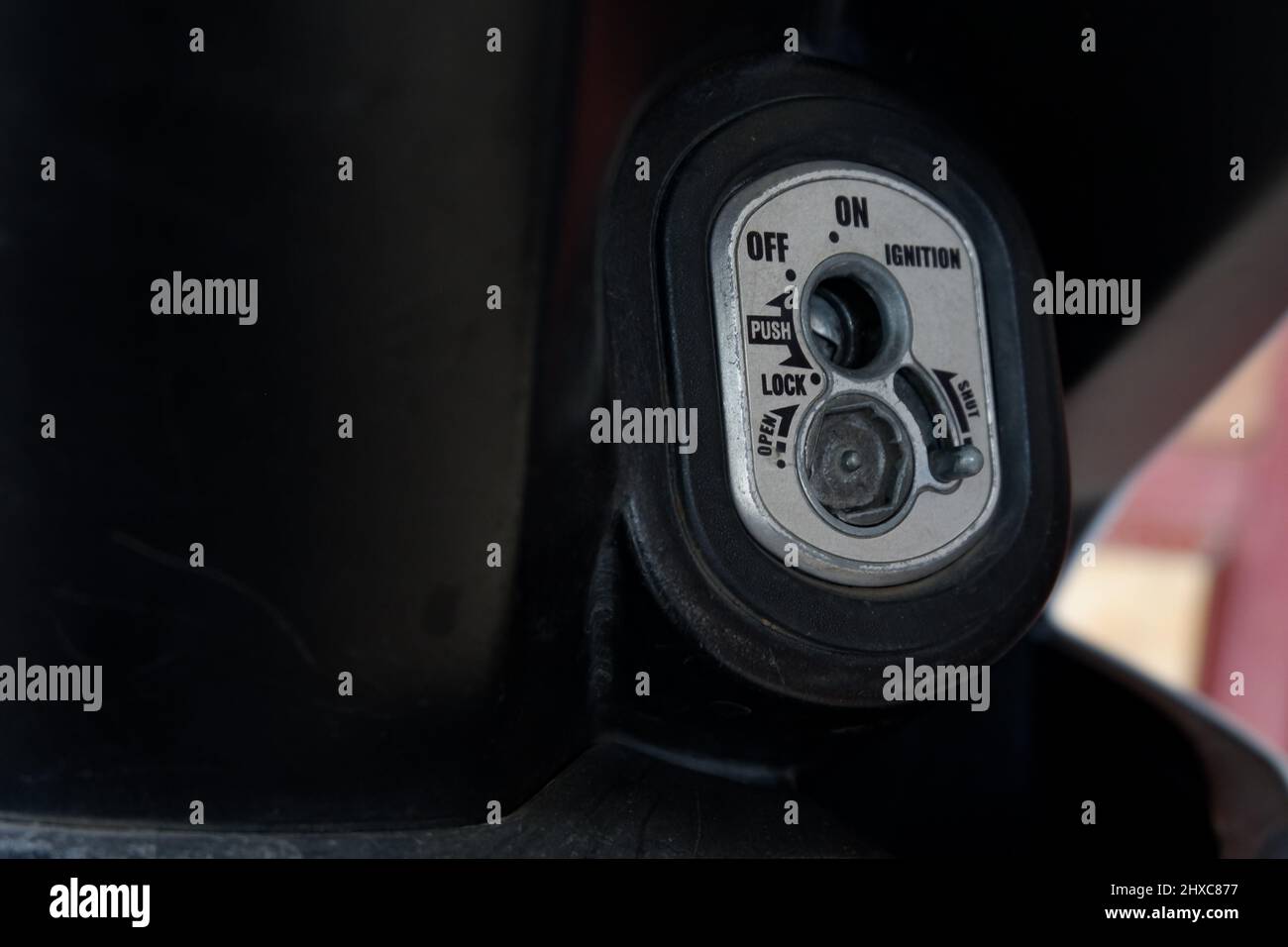 Close up motorcycle keyhole for ignition and lock in the open state