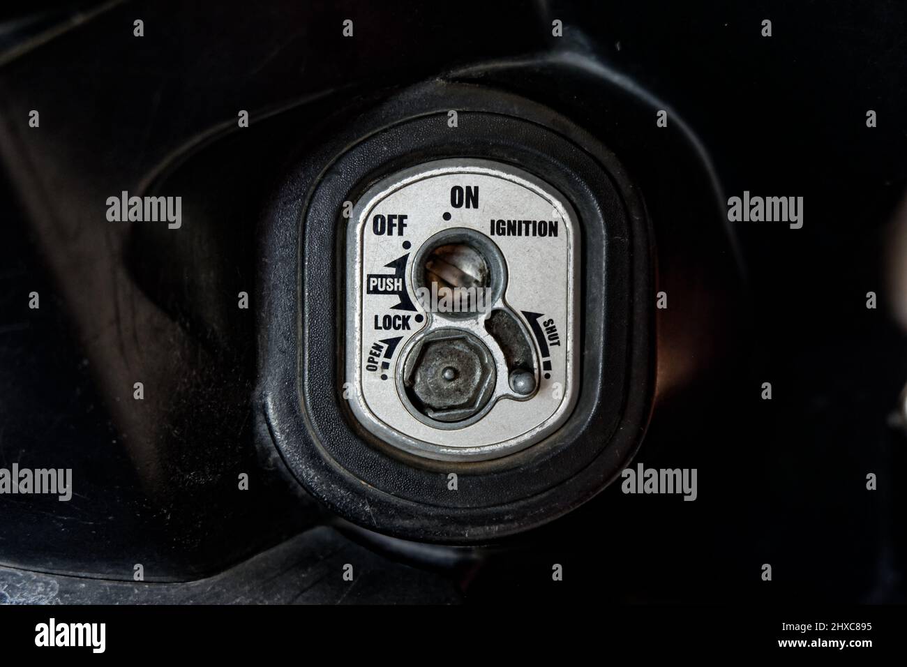 Close up motorcycle keyhole for ignition and lock in the open state