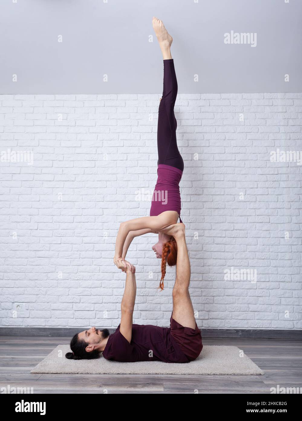 Yoga couple, Young healthy yoga fitness acrobatic couple having fun in the  gym performing and practicing funny acrobat poses real people training  workout Stock Photo | Adobe Stock