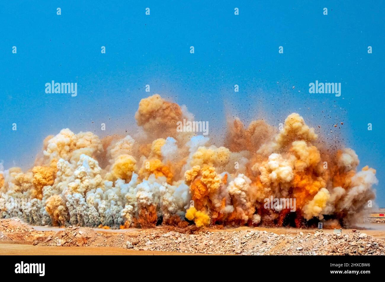 Exploding Desert Rocks Fascinating view of the rock blasting in the Arabian desert Stock Photo ...