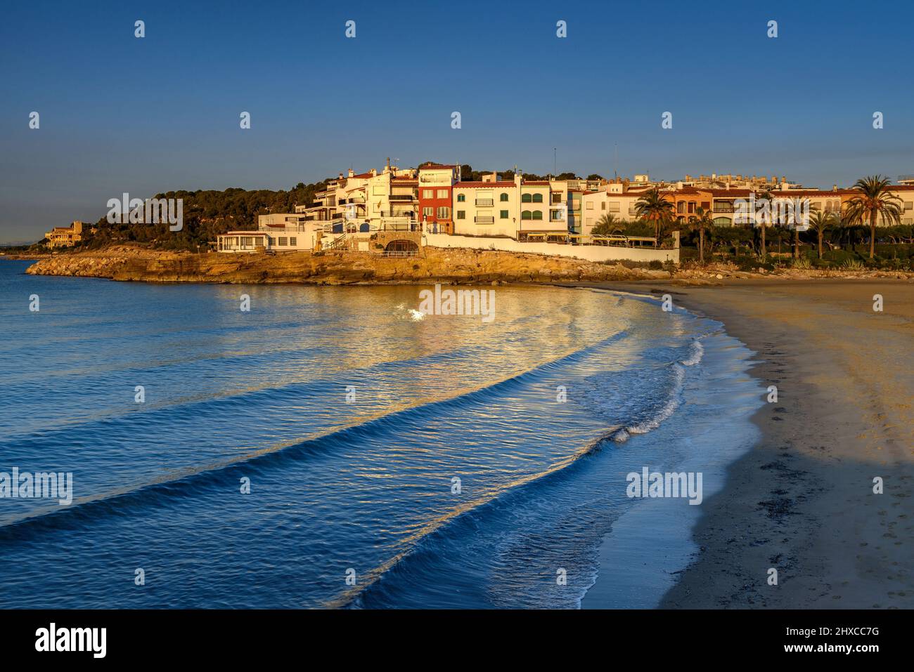 Sunrise on Roc de Sant Gaietà town and beach, on the Costa Daurada Coast (Tarragona, Catalonia, Spain) ESP: Amanecer en Roc de Sant Gaietà, Tarragona Stock Photo