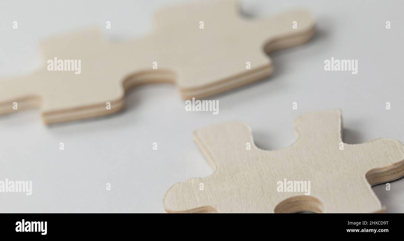 Image of wooden piece of puzzle over white background Stock Photo - Alamy