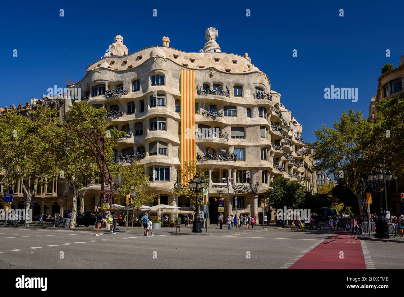Gaudí's La Pedrera (Casa Milà) with the Catalan flag in commemoration of September 11, Catalonian Day (Barcelona, Catalonia, Spain) Stock Photo