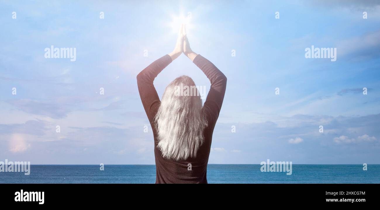 Woman with white hair by the sea Stock Photo