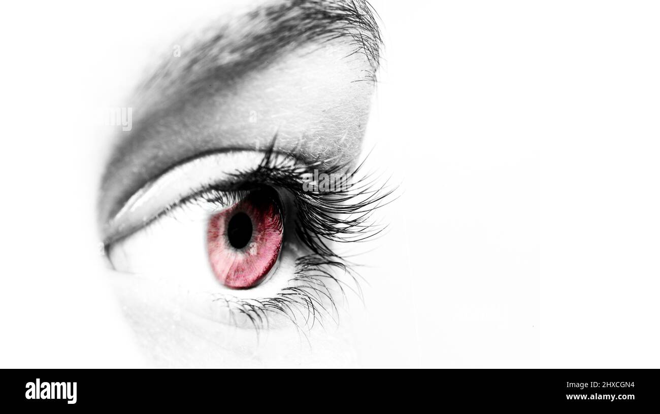 Eye with a pink pupil against white background Stock Photo