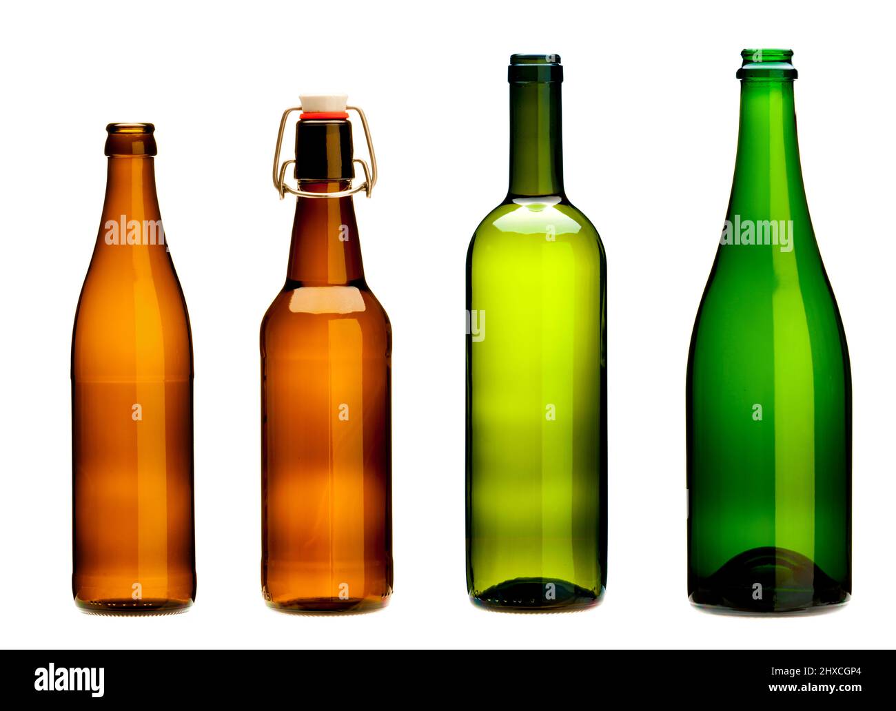 Four empty bottles, brown glass and green glass Stock Photo Alamy